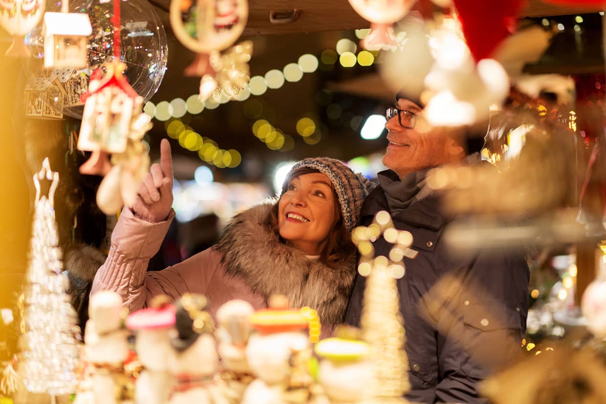 Couple browsing stalls at a Holiday Market 